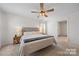 Bright bedroom featuring neutral carpet, ceiling fan, and neatly made bed at 446 Misty Law Ln, Clover, SC 29710