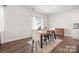 Well-lit dining area with wooden table, rug, and view to the backyard at 446 Misty Law Ln, Clover, SC 29710