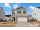 Charming two-story home with a two-car garage, landscaped front yard, and inviting curb appeal at 446 Misty Law Ln, Clover, SC 29710