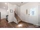 Inviting foyer with hardwood floors, stairs to the second floor, and an attractive front door at 446 Misty Law Ln, Clover, SC 29710