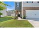 Charming home facade with a welcoming front door, rocking chair and well-kept lawn at 446 Misty Law Ln, Clover, SC 29710