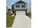 Two story home featuring brick accents, a two car garage and well manicured front yard at 446 Misty Law Ln, Clover, SC 29710