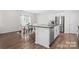 Open concept kitchen and dining area with granite countertops and stainless appliances at 446 Misty Law Ln, Clover, SC 29710