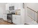 Modern kitchen featuring stainless steel appliances, granite countertops, and white cabinetry at 446 Misty Law Ln, Clover, SC 29710