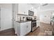 Modern kitchen featuring white cabinets, stainless steel appliances and granite counters at 446 Misty Law Ln, Clover, SC 29710