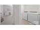 Convenient laundry area with washer, dryer, and additional space for storage in an adjacent room at 446 Misty Law Ln, Clover, SC 29710