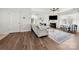 Comfortable living room featuring hardwood floors, a fireplace, and ample natural light at 446 Misty Law Ln, Clover, SC 29710