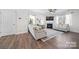 Cozy living room with a fireplace, ceiling fan, and comfortable seating at 446 Misty Law Ln, Clover, SC 29710