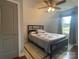 Cozy bedroom featuring a ceiling fan, natural light, and a comfortable bed with decorative pillows at 517 Grassy Creek Run, Chester, SC 29706