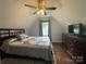 A bedroom featuring a ceiling fan, natural light, comfortable bed, and a dresser with a TV at 517 Grassy Creek Run, Chester, SC 29706