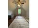 Attic bedroom with sloped ceiling, plush rug, and window view at 517 Grassy Creek Run, Chester, SC 29706