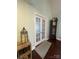 A foyer featuring French doors, wood floors, a wooden lantern table, and a grandfather clock at 517 Grassy Creek Run, Chester, SC 29706