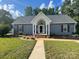 Inviting single-story home with a covered entrance and manicured front lawn at 517 Grassy Creek Run, Chester, SC 29706