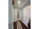Bright hallway with hardwood floors and sliding barn door at 517 Grassy Creek Run, Chester, SC 29706
