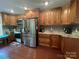 A kitchen with wood cabinets, stainless steel appliances, and granite countertops at 517 Grassy Creek Run, Chester, SC 29706