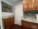 A kitchen view showcasing granite countertops, tiled backsplash, wooden cabinets, and a white interior door at 517 Grassy Creek Run, Chester, SC 29706
