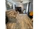 Cozy living room with plush reclining sofa, accent rug, and desk work space at 517 Grassy Creek Run, Chester, SC 29706