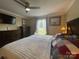 Well-decorated primary bedroom with a large window, decorative lamps, and plenty of storage at 517 Grassy Creek Run, Chester, SC 29706