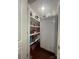 This pantry offers great storage with shelves and white refrigerator for keeping goods organized and fresh at 517 Grassy Creek Run, Chester, SC 29706
