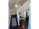 View of carpeted staircase with wooden banister and railing leading to the upper level of this home at 517 Grassy Creek Run, Chester, SC 29706