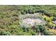 Aerial view of property showcasing the home, long driveway, and lush, green surrounding trees at 5262 Mckenzie Trl, Conover, NC 28613