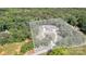 Aerial view of property showing the home, driveway, and surrounding wooded landscape at 5262 Mckenzie Trl, Conover, NC 28613
