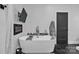 Luxurious bathroom showcasing a modern soaking tub, an electric fireplace, and a wall mounted television at 5262 Mckenzie Trl, Conover, NC 28613