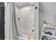 Elegant bathroom featuring a tub-shower combo with marble tiling, contemporary fixtures, and a minimalist design at 5262 Mckenzie Trl, Conover, NC 28613