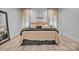 Bright bedroom with a large bed featuring stylish pillows and neutral decor and lighting at 5262 Mckenzie Trl, Conover, NC 28613