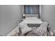 Comfortable bedroom with soft gray walls and a cushioned bench at the end of a well-made bed at 5262 Mckenzie Trl, Conover, NC 28613