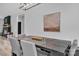 Formal dining area featuring a dark wood table, gray seating and modern lighting at 5262 Mckenzie Trl, Conover, NC 28613