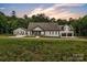 Lovely exterior view of home with a large front yard and long private driveway at 5262 Mckenzie Trl, Conover, NC 28613