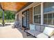 Cozy front porch offers comfortable seating and a relaxing atmosphere and a modern door at 5262 Mckenzie Trl, Conover, NC 28613