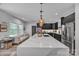 Modern kitchen featuring a large island, a marble countertop and sleek, black cabinets at 5262 Mckenzie Trl, Conover, NC 28613