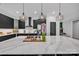 Modern kitchen with island sink, marble counters, stylish lighting, and stainless steel appliances at 5262 Mckenzie Trl, Conover, NC 28613