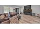 Spacious living room featuring a modern fireplace, large TV, and natural light at 5262 Mckenzie Trl, Conover, NC 28613