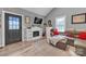 Cozy living room with a fireplace, neutral walls, a plush gray sofa, and stylish decor at 5262 Mckenzie Trl, Conover, NC 28613