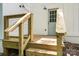 A new wooden back porch with modern railings and an entry door at 5444 Datha Ave, Charlotte, NC 28269