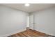 Bedroom with wood-look flooring, neutral paint and a white doors at 5444 Datha Ave, Charlotte, NC 28269