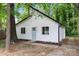 Charming home features a white exterior, black trim, and a cozy front yard at 5444 Datha Ave, Charlotte, NC 28269