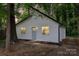 Charming home features a white exterior, black trim, and a cozy front yard at 5444 Datha Ave, Charlotte, NC 28269