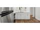 Modern kitchen features white cabinetry, stainless appliances, and updated countertops at 5444 Datha Ave, Charlotte, NC 28269