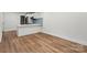 Bright open-concept living space features hardwood floors and white walls at 5444 Datha Ave, Charlotte, NC 28269