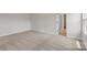 Bedroom with neutral colored walls, carpet, and trim at 5606 Skinny Dr, Charlotte, NC 28215