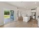 Open floorplan featuring a kitchen with granite countertops and stainless steel appliances at 5607 Skinny Dr, Charlotte, NC 28215