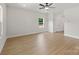 Spacious living room with neutral paint, a ceiling fan, and hardwood floors at 5607 Skinny Dr, Charlotte, NC 28215