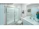 Modern bathroom featuring a glass enclosed shower, white vanity with sink, and neutral wall colors at 578 Sparkleberry St, Chester, SC 29706