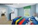 A bedroom featuring colorful bedding, soft lighting, and playful decor at 578 Sparkleberry St, Chester, SC 29706