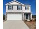 Charming two-story home featuring stone accents, gray siding, and a two-car garage at 578 Sparkleberry St, Chester, SC 29706
