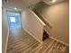 Hallway with wood-look flooring and stairs leading to upper floor of home at 578 Sparkleberry St, Chester, SC 29706